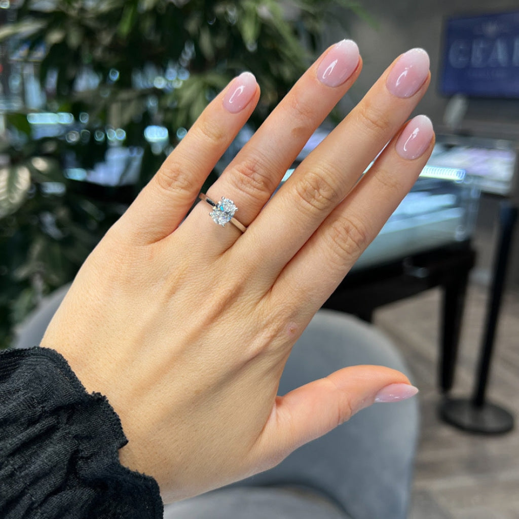 Woman's hand wearing Paris Engagement Ring in Platinum.
