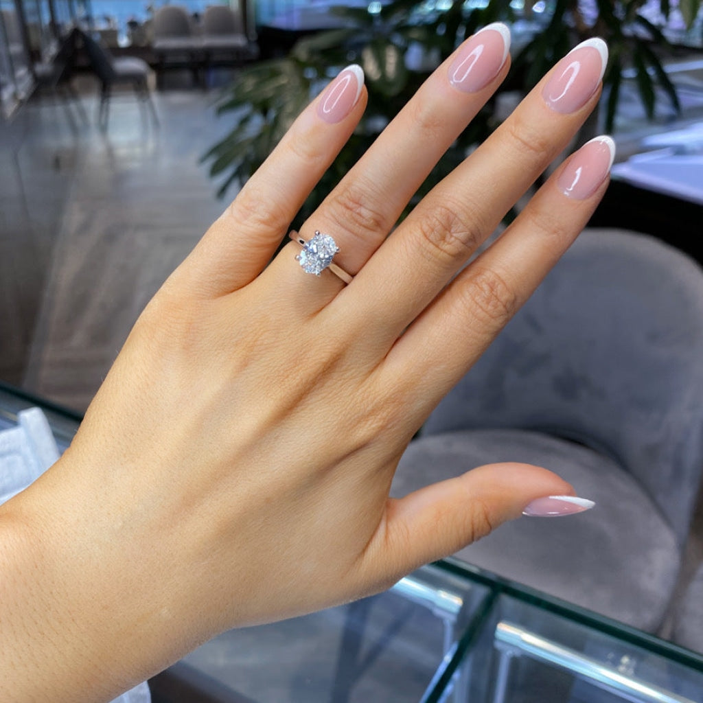 Platinum Lab grown engagement ring on hand