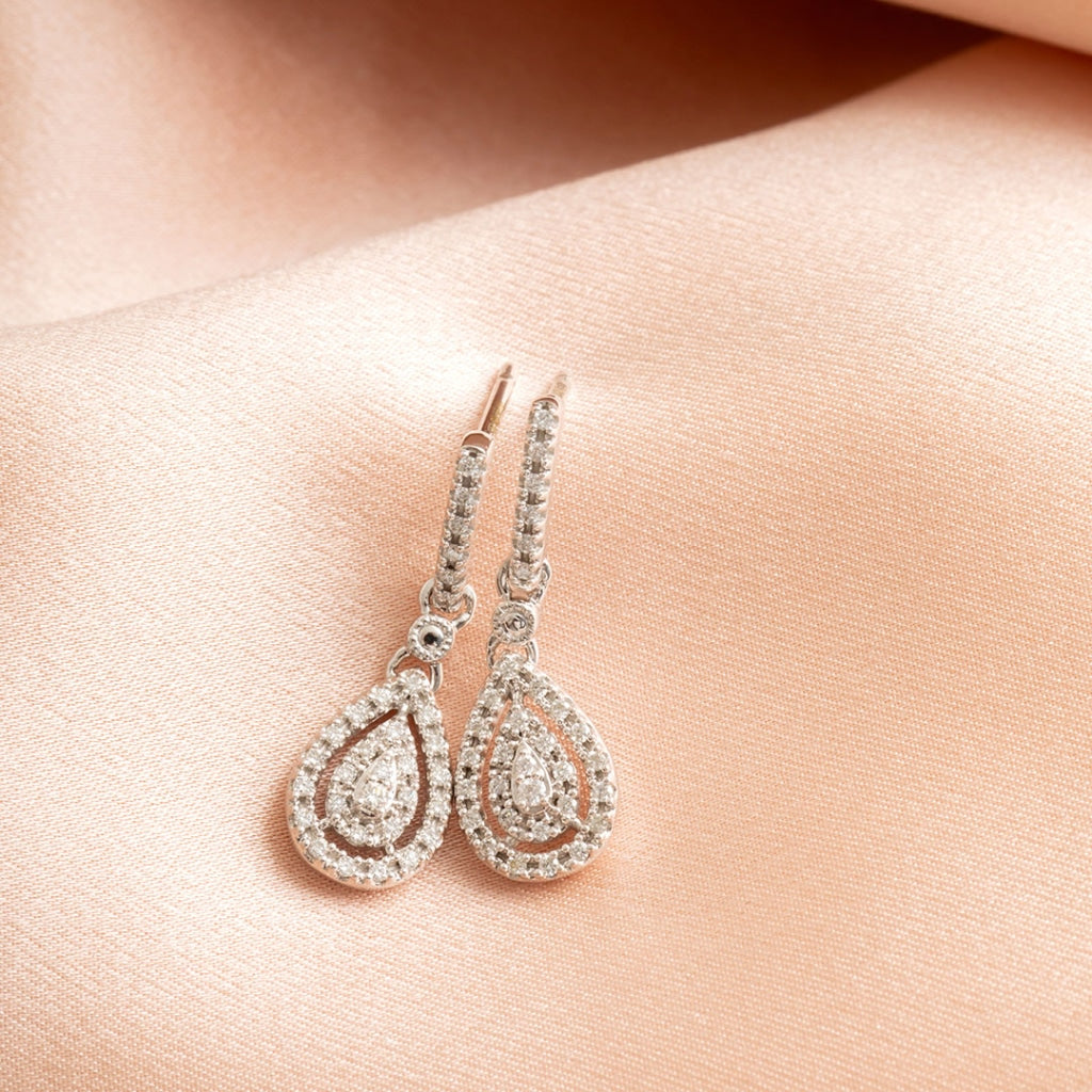 diamond drop earrings on fabric