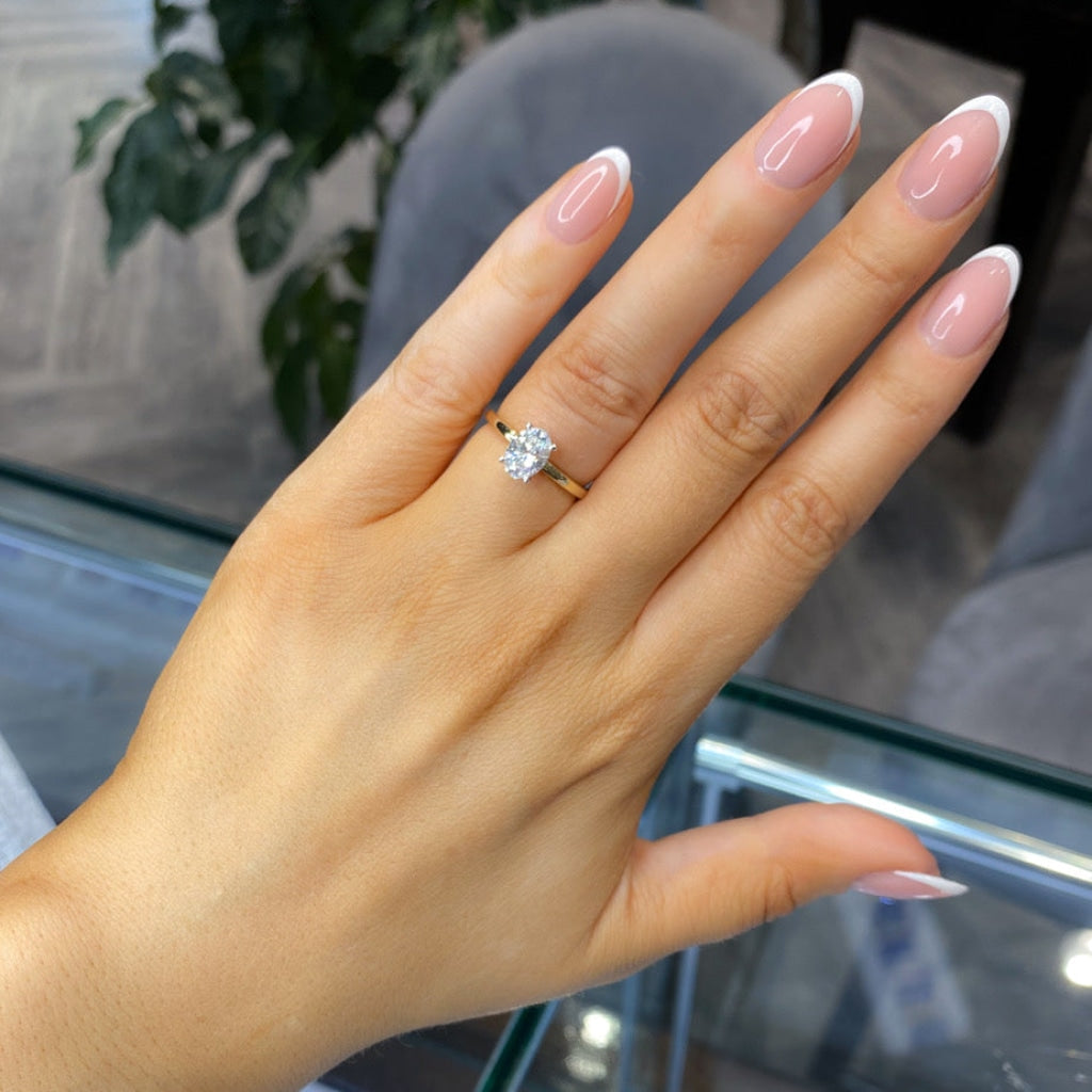 Penny lab grown diamond engagement ring worn on hand