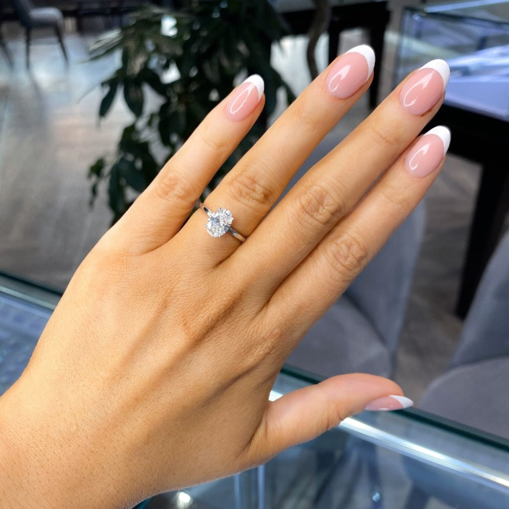 Platinum Lab grown diamond engagement ring on the finger