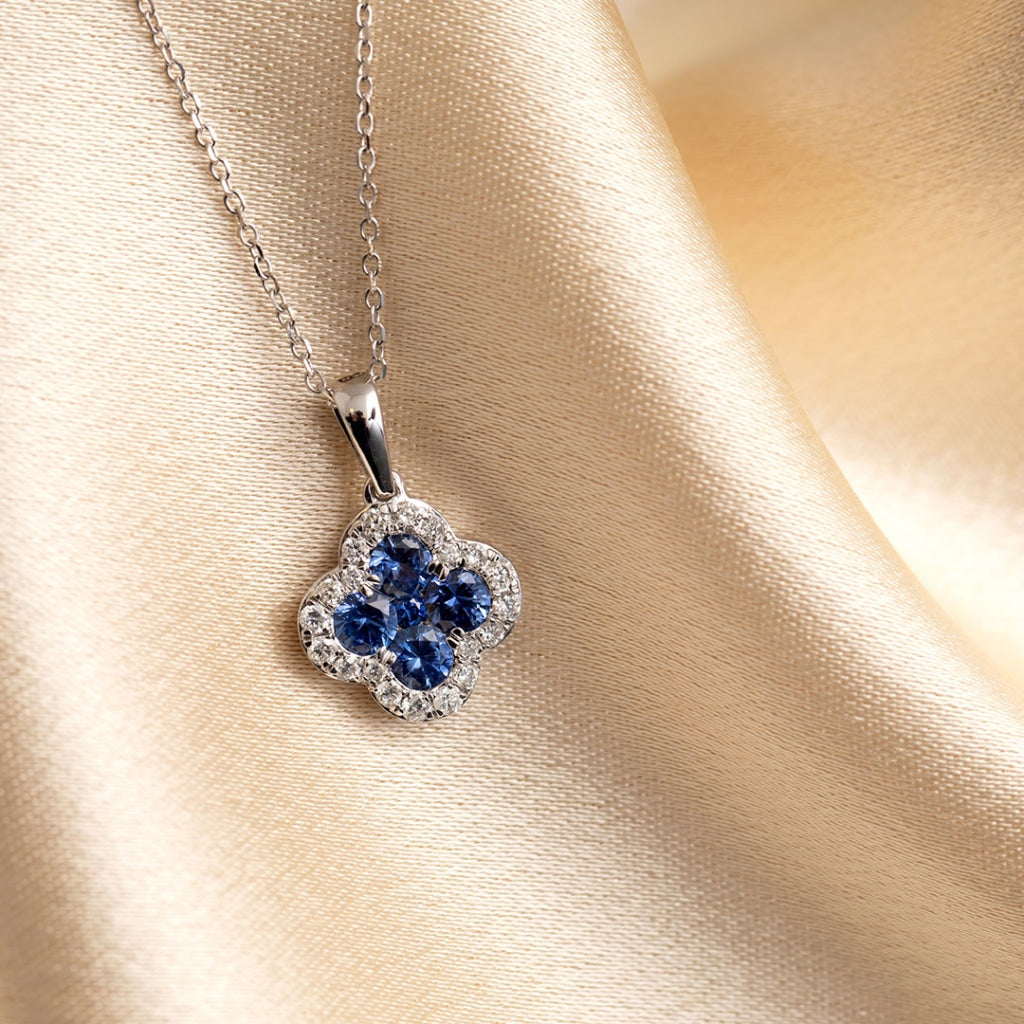 Sapphire and diamond necklace on fabric