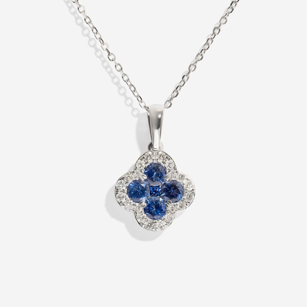 Sapphire and diamond white gold necklace on white background