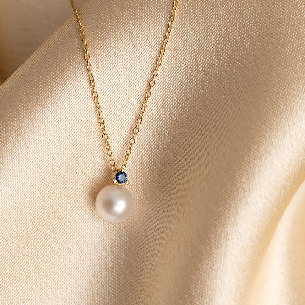 Pearl necklace with blue cz image