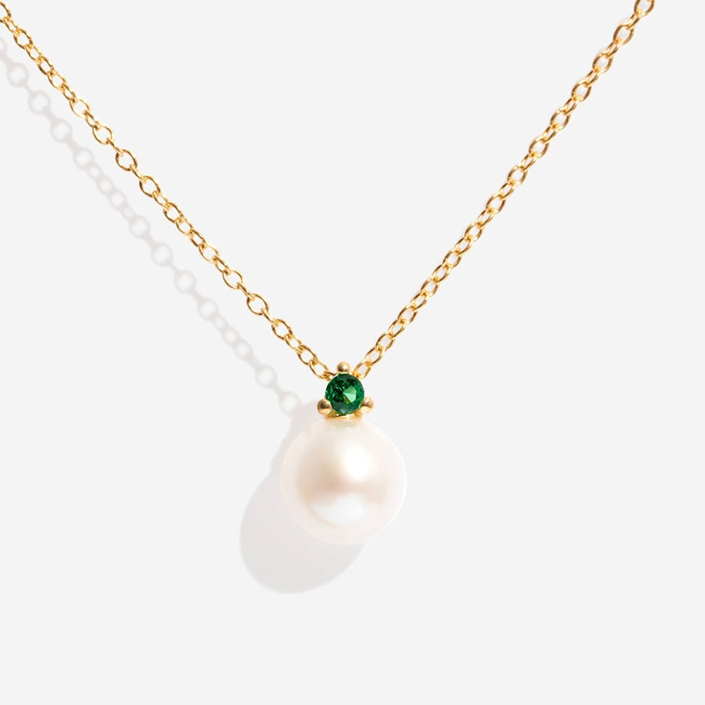 Pearl green cz necklace on white background