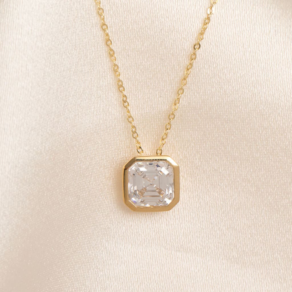 asscher cut bezel set necklace in yellow gold