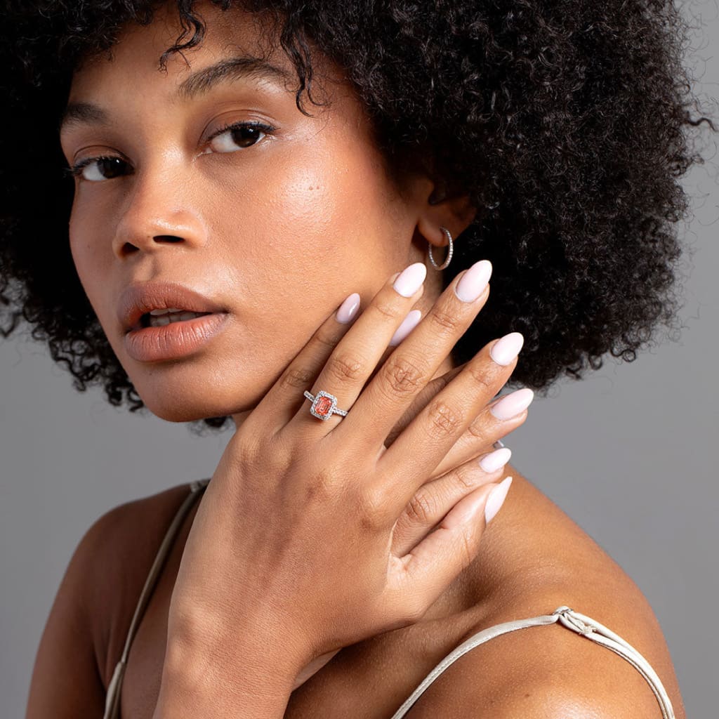 Model wearing Pink diamond engagement ring