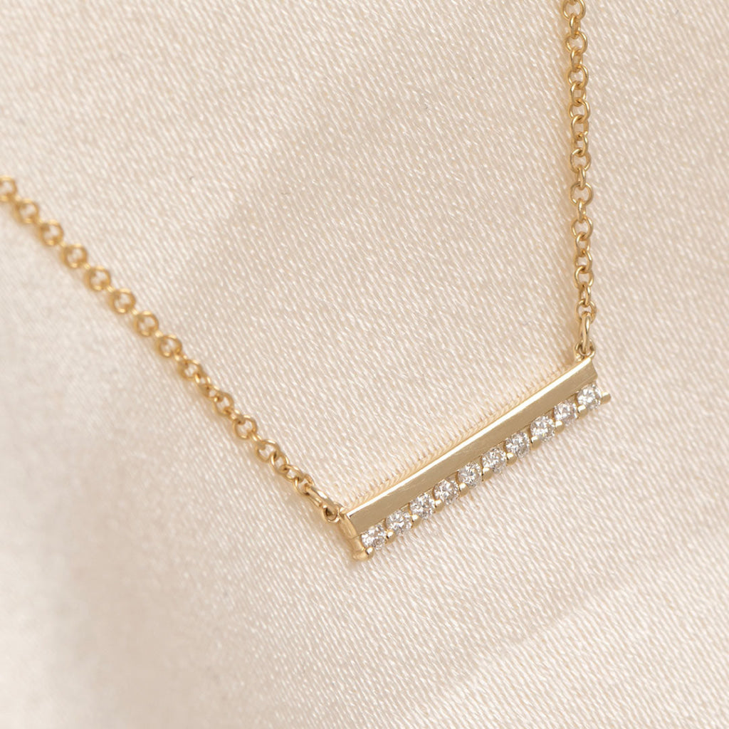 yellow gold diamond set bar necklace