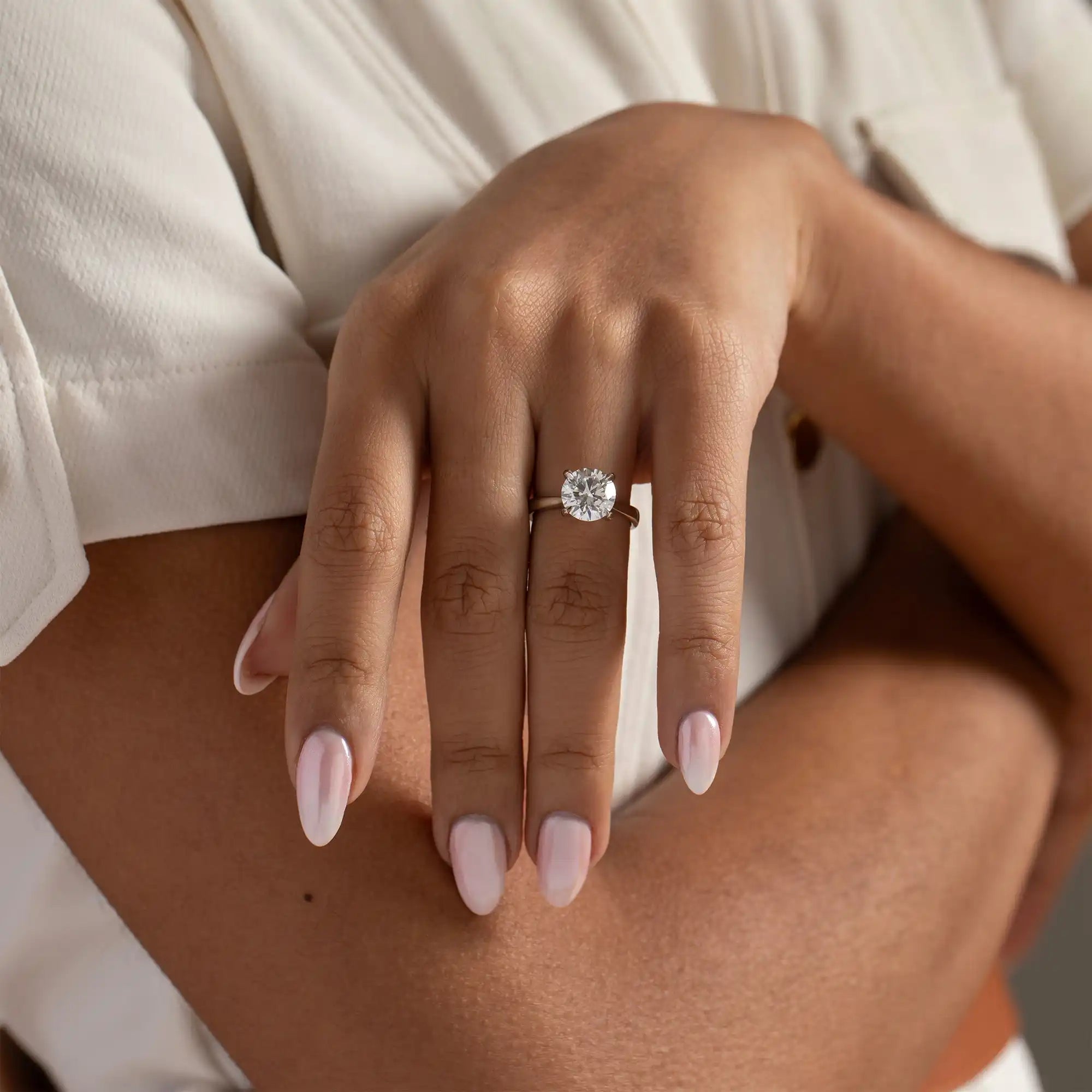 Round-cut diamond engagement ring.