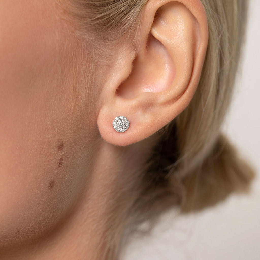 diamond halo earrings in models ear