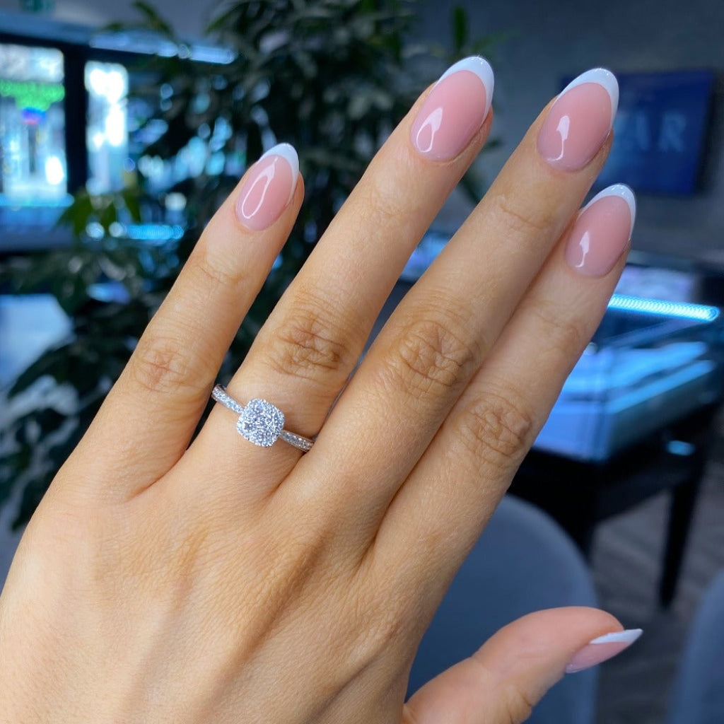 White gold diamond engagement ring on women's hand