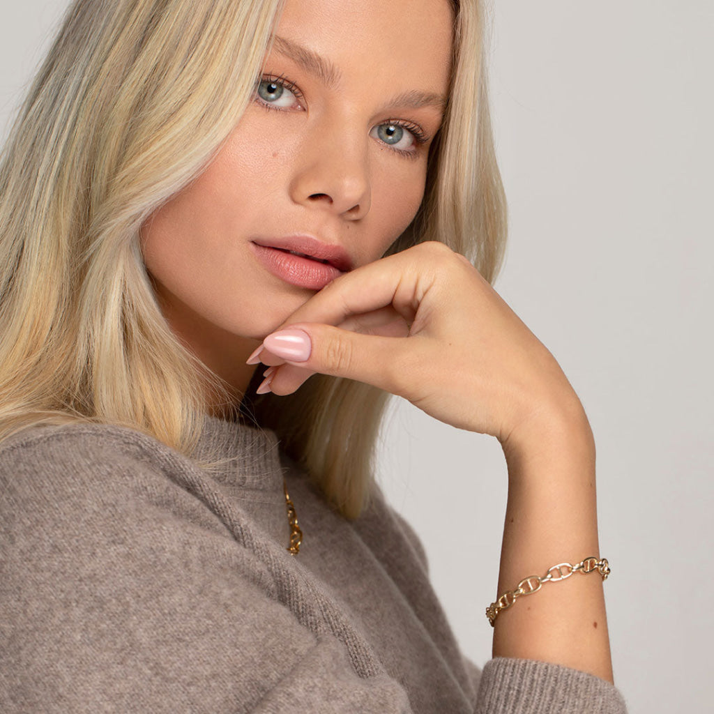 model wearing yellow gold bracelet