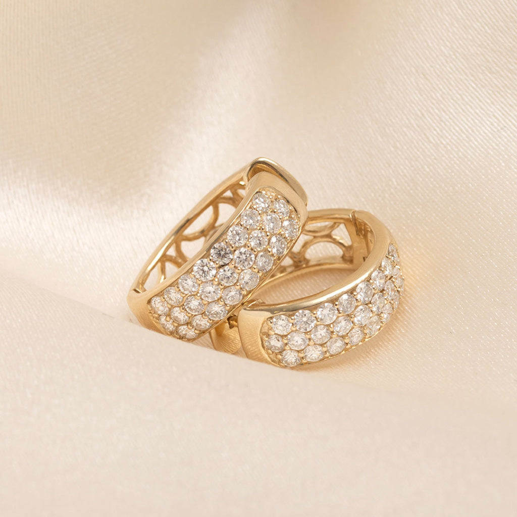 side view of yellow gold diamond set hoops
