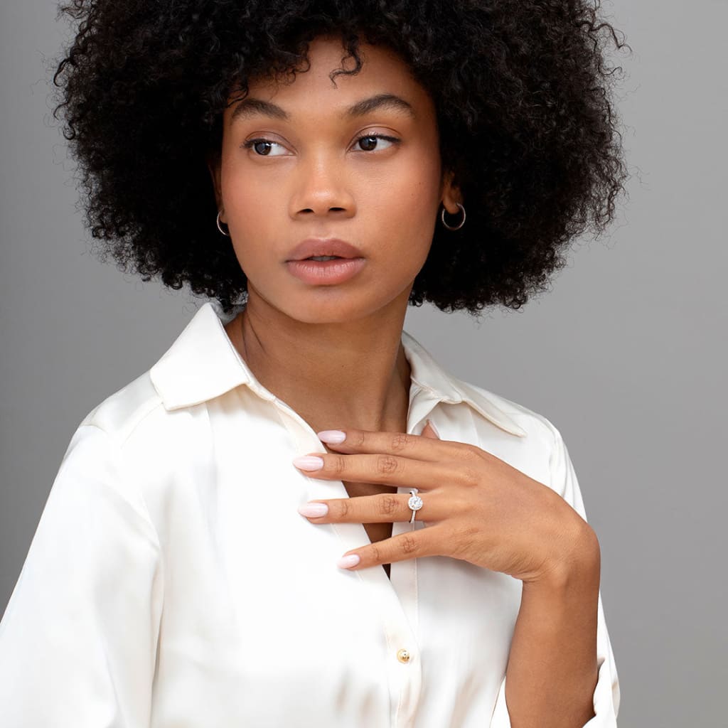 Hand model wearing Sheldon oval engagement ring