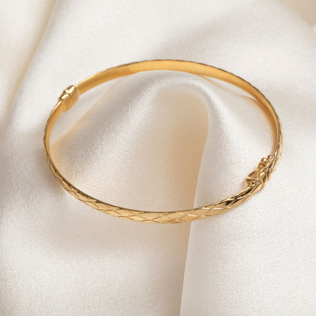 yellow gold textured bangle with clasp