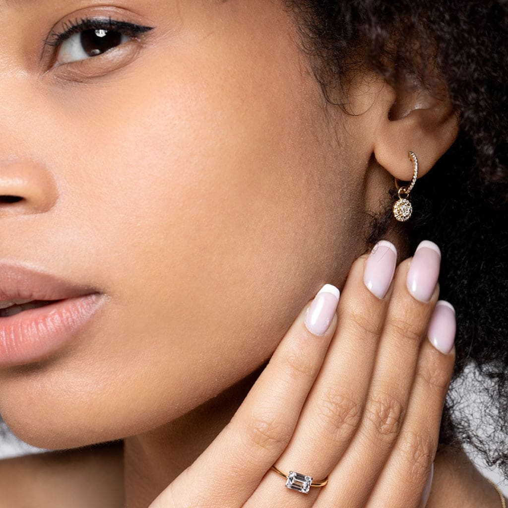 Suki lab grown diamond engagement ring on models hand close up