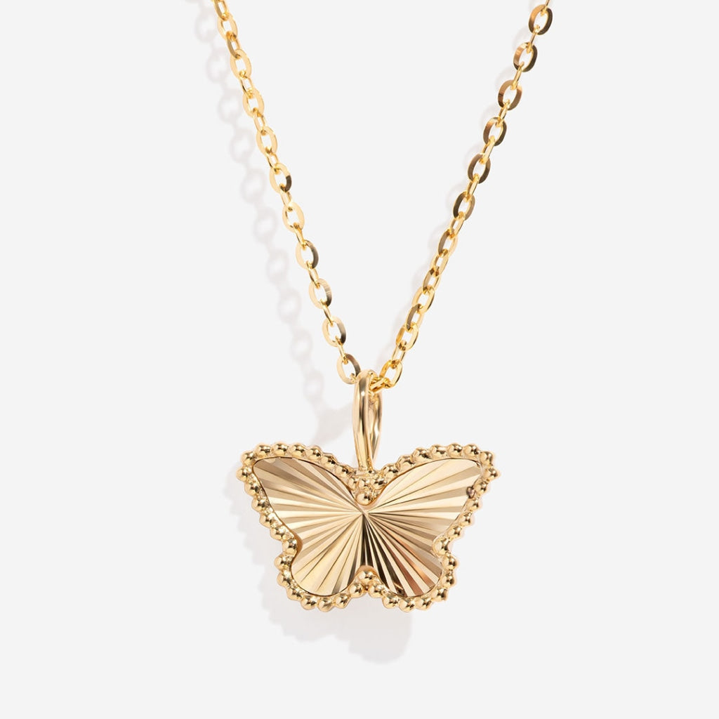 Butterfly necklace on white background