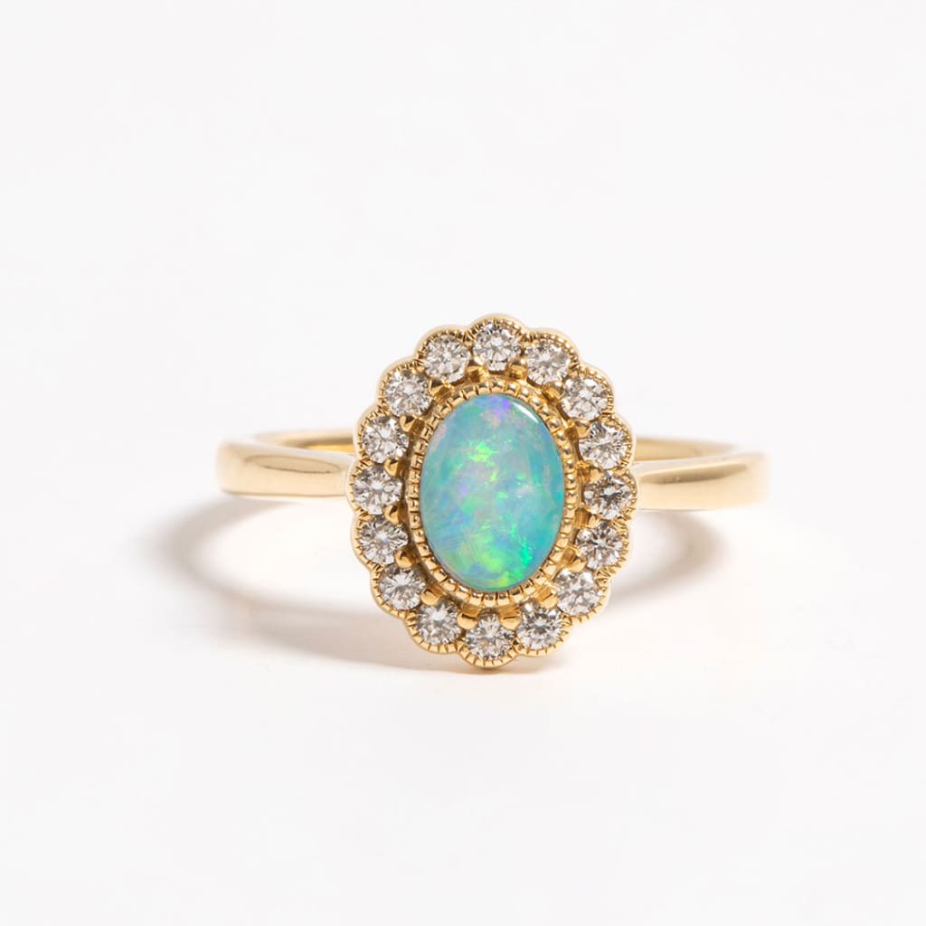 opal and diamond engagement ring with diamond halo