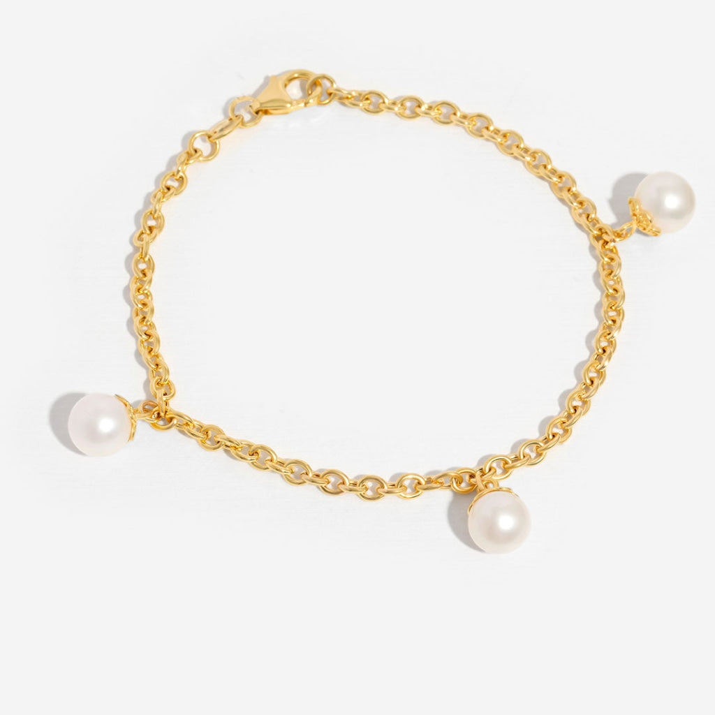 triple pearl drop bracelet on white background