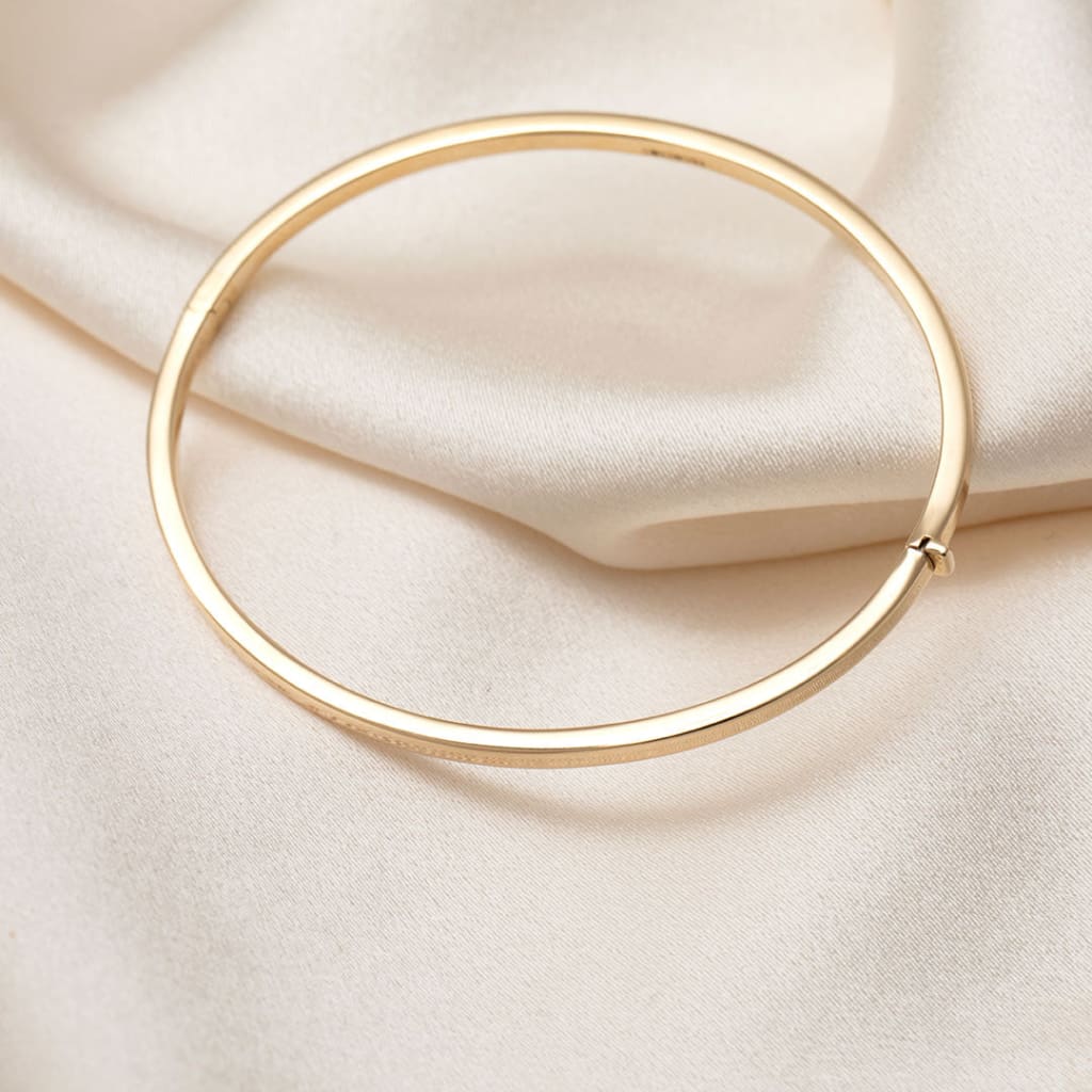 Triumph Bangle | 9ct Gold