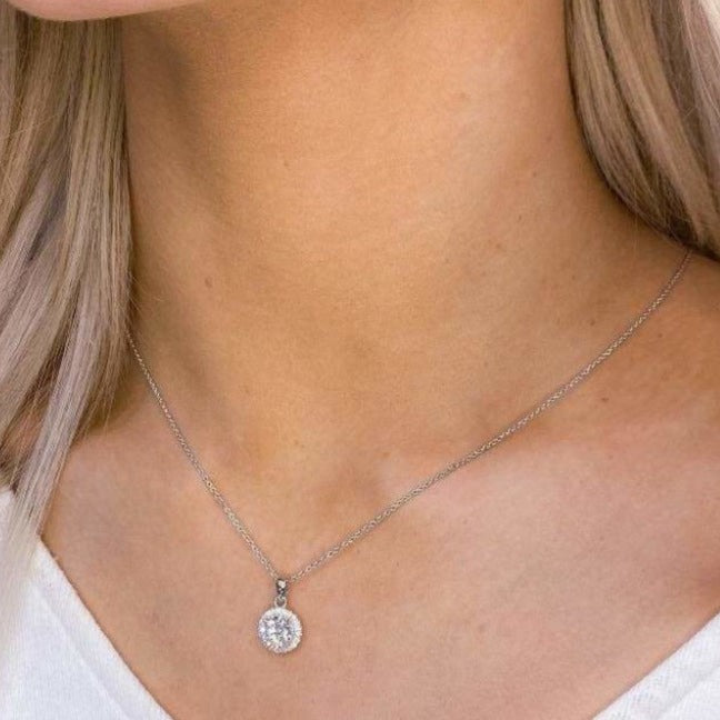 woman wearing sterling silver round necklace