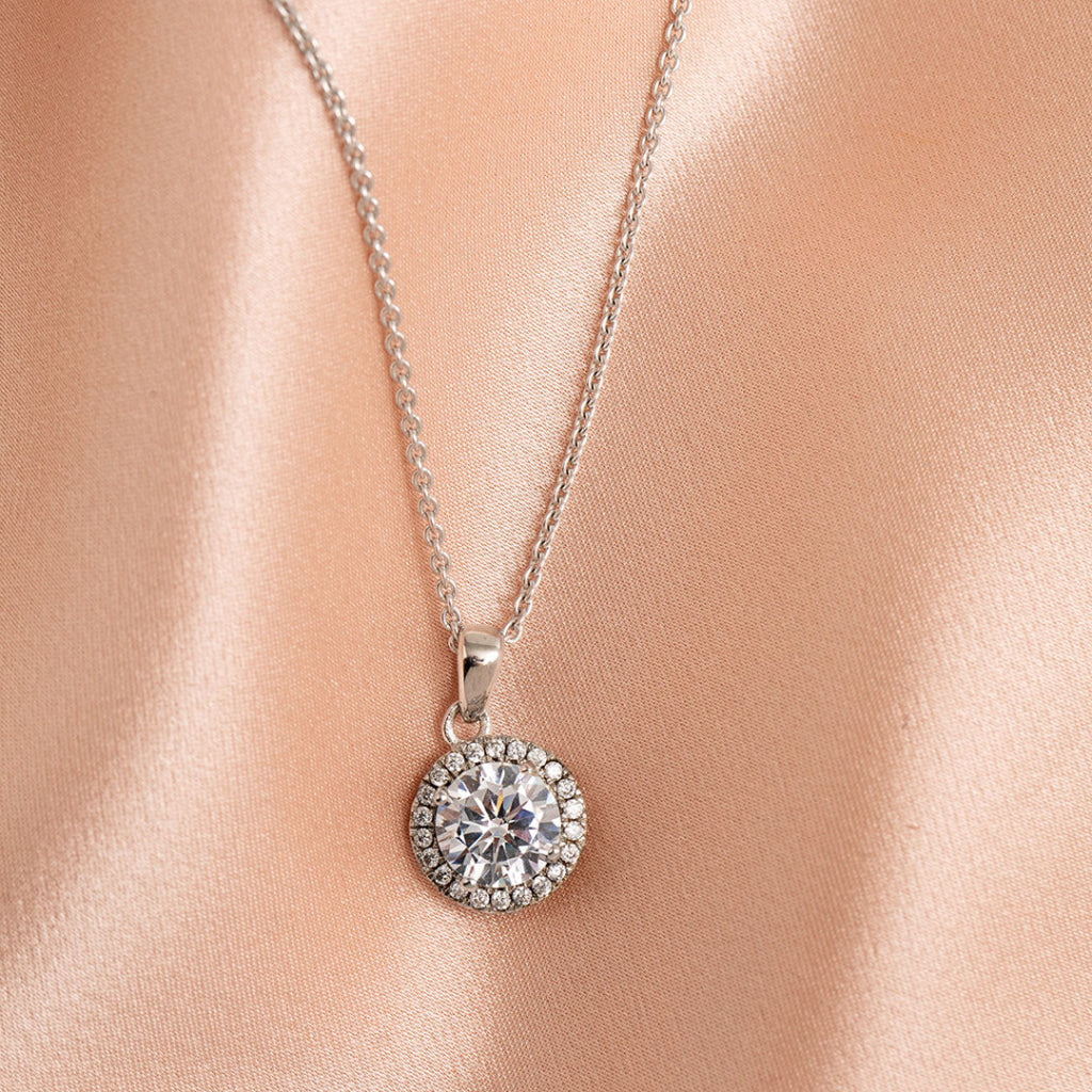 woman wearing sterling silver round necklace