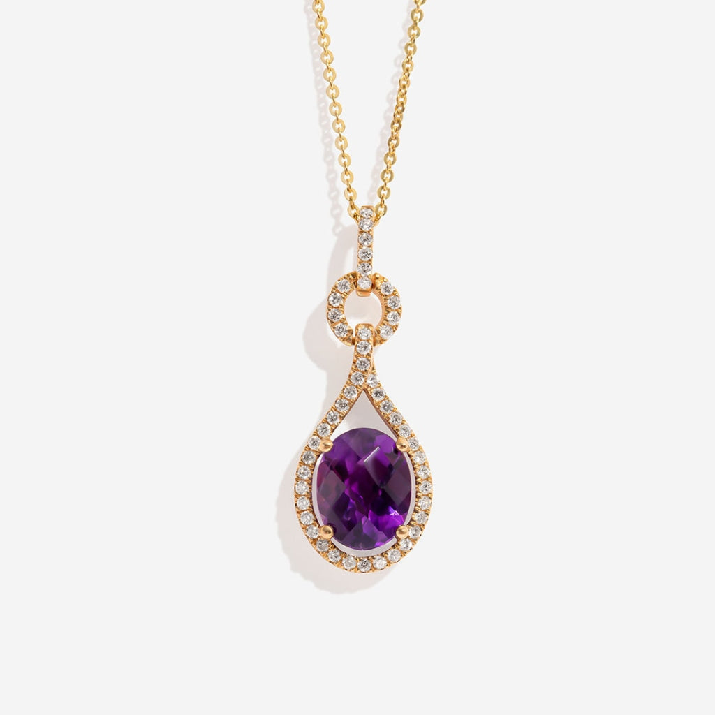 Amethyst and diamond necklace on white background