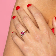 Model wearing 2 rings ruby and diamond side by side.