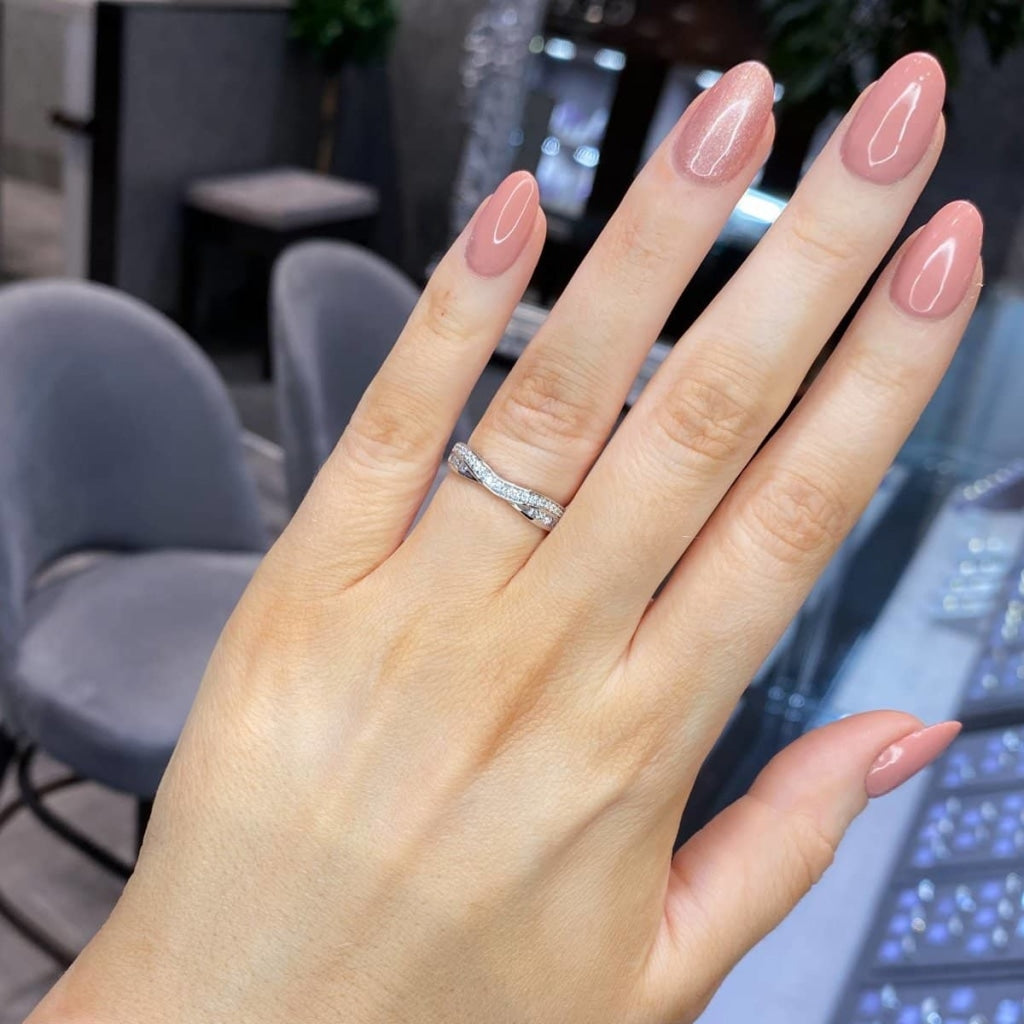 Diamond Wedding Ring on a woman's hand.