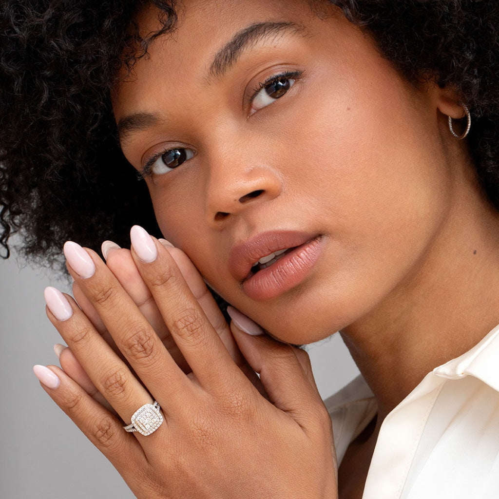 Hand model wearing vogue diamond engagement ring