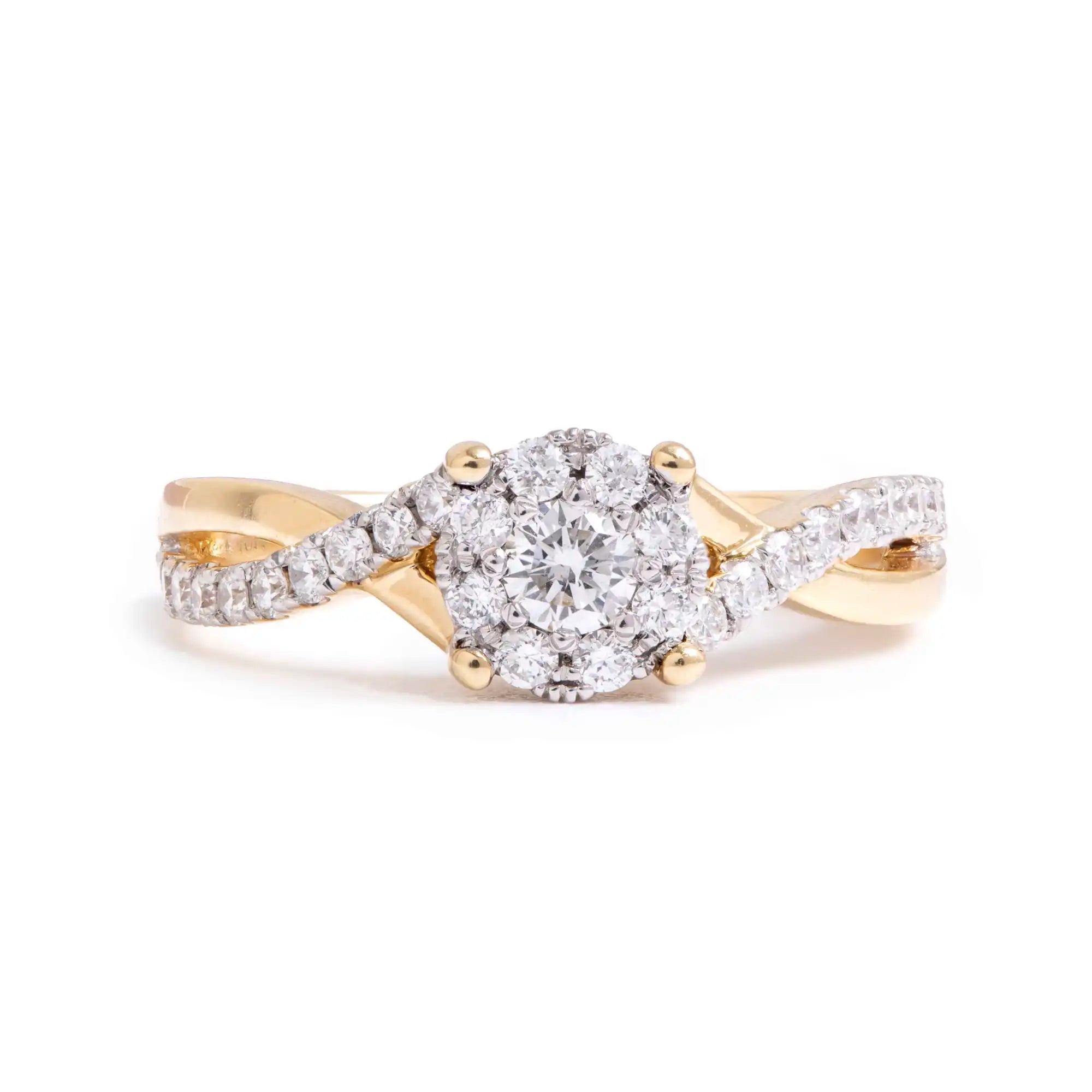 Yellow and white gold diamond engagement ring with twisted band design.