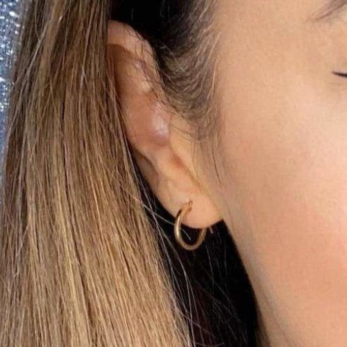 Woman wearing 9ct gold Plain Hoop Earrings 10mm | Gear Jewellers Dublin