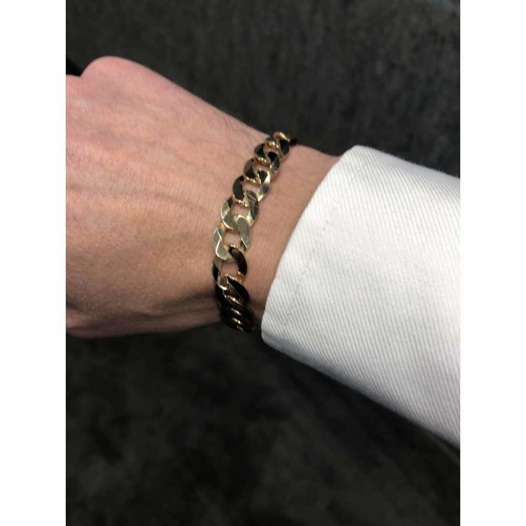 9ct gold Gents Curb bracelet on a mans wrist.