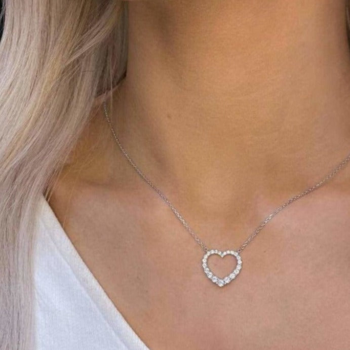 Woman wearing sterling silver Love You Forever necklace.